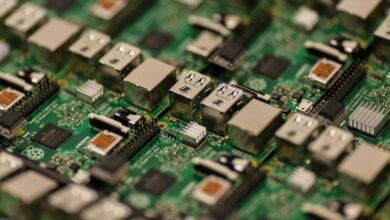 Detailed shot of a Raspberry Pi circuit board showcasing its components, USB ports, and microchips.