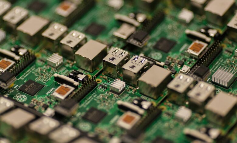 Detailed shot of a Raspberry Pi circuit board showcasing its components, USB ports, and microchips.