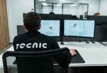 A person works on a computer in an office.