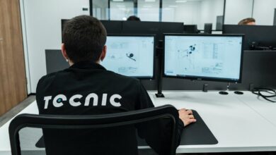A person works on a computer in an office.