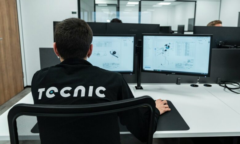 A person works on a computer in an office.