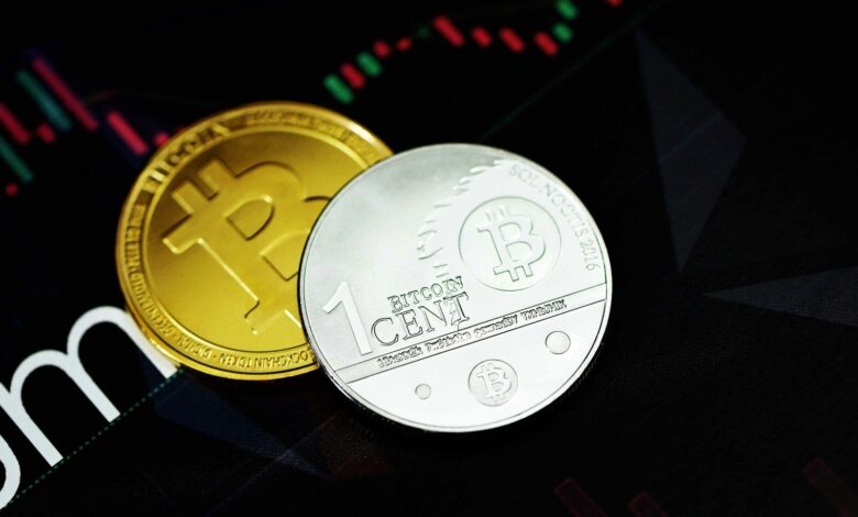 gold round coin on black surface