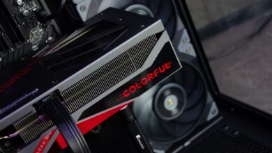 A close up of a computer with a red and black logo on it