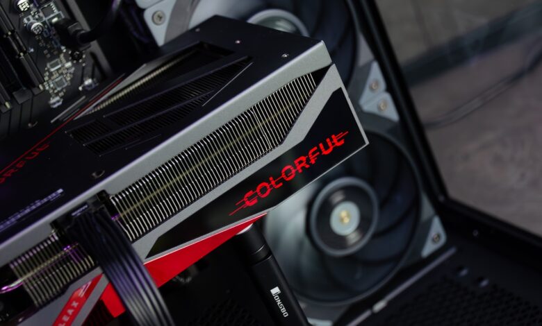 A close up of a computer with a red and black logo on it