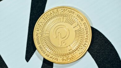 a close up of a gold coin on a black and white background