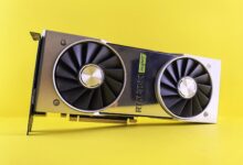 A close up of a video card on a yellow background