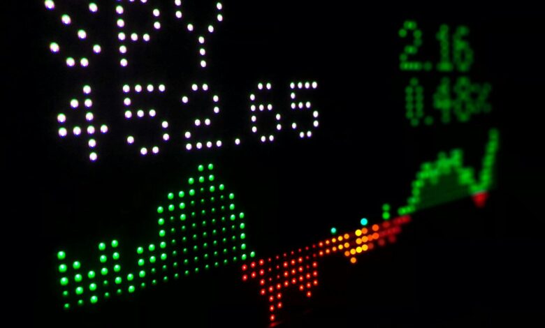 a close up of a clock with different colored numbers