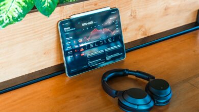 a pair of headphones sitting on top of a wooden table