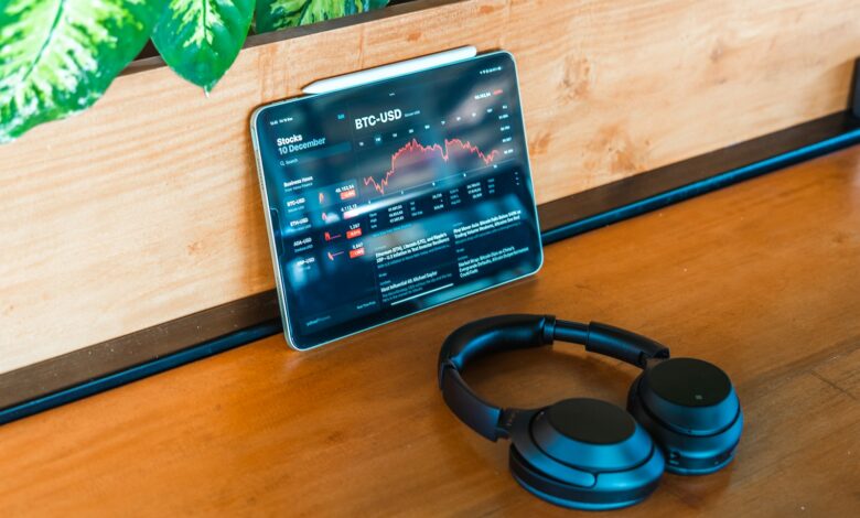 a pair of headphones sitting on top of a wooden table