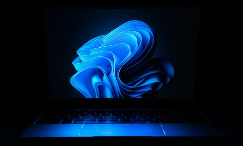 a macbook air laptop in the dark