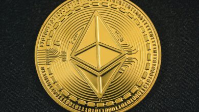 a gold coin with the symbol of ether on it