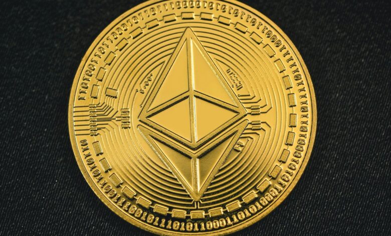 a gold coin with the symbol of ether on it